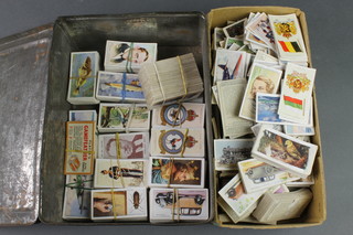 A collection of various cigarette cards 