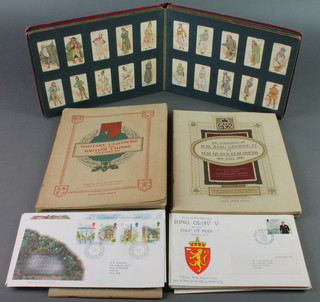 An album of various Wills cigarette cards, 5 albums of Players cigarette cards - 2 x Uniforms and Territorial Army, 2 x Military Uniforms of the British Empire Overseas and 1  George VI  Coronation, ditto Dogs and a small collection of Continental first day covers 