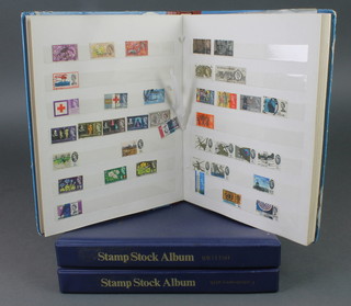 An album of mint GB stamps together with an album of used world stamps and a stock book of used GB stamps 