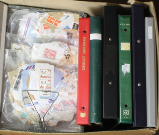 A Stanley Gibbon album of various mint and used GB stamps including 4 penny reds, penny blue, a green album of George V used GB stamps, a Stanley Gibbons album of Canadian stamps Victoria - 1960, 2 ring binders and a stock book of world stamps together with 2 box files