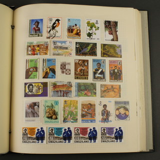 An album of stamps including Swaziland, Sudan, Tanganyika