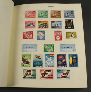 An album of stamps including Gambia, Ghana, Ellice Island, Gilbert Isles, Gold Coast, Grenada