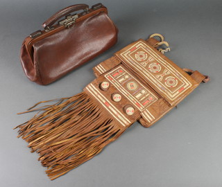 A leather Gladstone bag 5"h x 13"w x 5"d and a Moroccan? leather hand bag 
