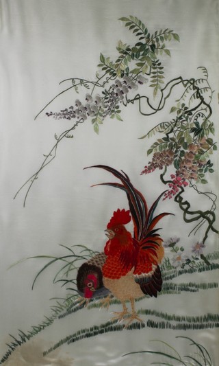 Japanese embroideries, a pair, 20th Century studies of birds amongst exotic flowers 27" x 16" 