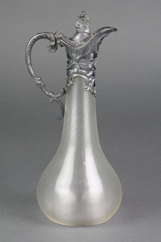 An Edwardian silver plated mounted ewer with Rococo decoration, the bulbous glass body with ribbed decoration 12" 