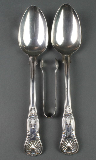 A pair of Victorian silver Kings pattern spoons and a pair of silver nips 216 grams