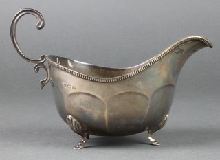 A silver sauce boat with S scroll handle on hoof feet, Birmingham 1939, 202 grams