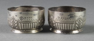 A pair of Victorian silver repousse table salts, London 1882, 76 grams
