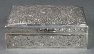 A 20th Century Egyptian silver rectangular cigarette box with chased scroll decoration 5 3/4" x 4" 