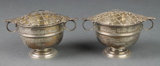 A pair of novelty silver rose bowls and grilles in the form of 2 handled trophy cups, London 1914, 226 grams