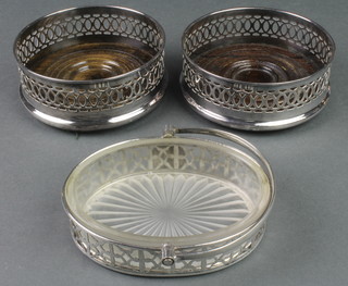 A pierced silver plated butter dish with swing handle, bearing the Basket Maker's crest with glass liner, 2 plated coasters 