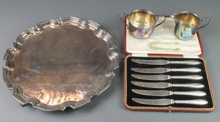 A silver plated salver with Chippendale rim 12", a cased set and minor items 