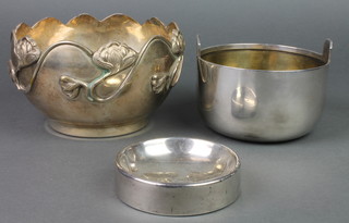 An Art Nouveau repousse silver plated bowl, a smaller ditto and a silver dish 