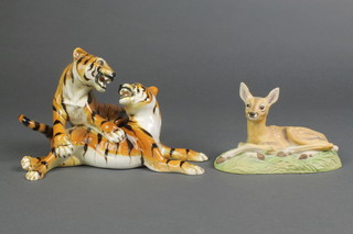 An Aynsley figure of a reclining roe deer fawn 6" and a Continental group of 2 tiers 8" 