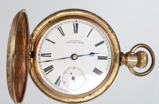 A gold plated repousse cased hunter pocket watch, the dial inscribed Waltham with seconds at 6 o'clock 