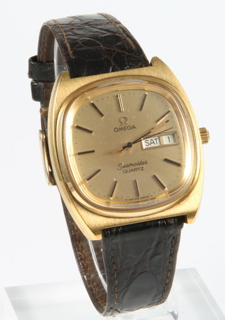 A 1970's gentleman's gold plated Omega Seamaster quartz calendar wristwatch on a leather strap 