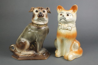 A Staffordshire figure of a pug with glass eyes 13", a ditto of a cat 13" 