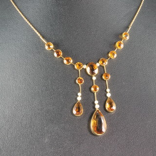 An Edwardian 15ct gold citrine and seed pearl drop pendant 
