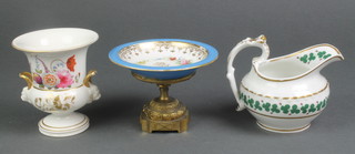 A 19th Century Continental porcelain dish with gilt and floral decoration bearing an armorial on a gilt metal base 4", a Paris porcelain vase 4" and a 19th Century jug 3" 