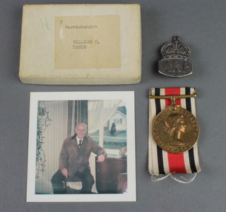 Queen Elizabeth II Special Constabulary medal to William H.Hands in posting box, together with silver ARP badge and photograph of recipient 