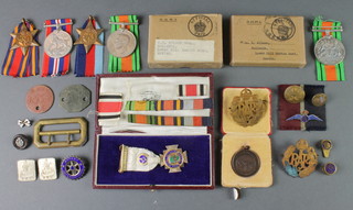 World War Two groups Burma 1939-45 Stars, Defence and War medal with dog tags and posting box to C H Wilson Esq and Defence medal and postbox to Mrs E Wilson together with minor badges, a silver Masonic medal, sports fob, 2 badges etc 