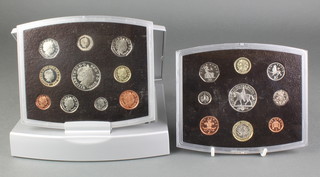 A 2002 presentation coin set and a Millennium ditto 