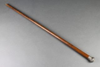 An Edwardian walking cane with repousse silver knop and monogram, London 1909