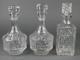 A cut glass mallet shaped decanter and stopper 11" and 2 others 