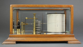 An Edwardian barograph contained in an oak and bevelled glass case, the top of the barrel marked 1041 