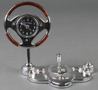 William Widdup, a desk timepiece in the form of a classic car steering wheel and gear stick 4" 
