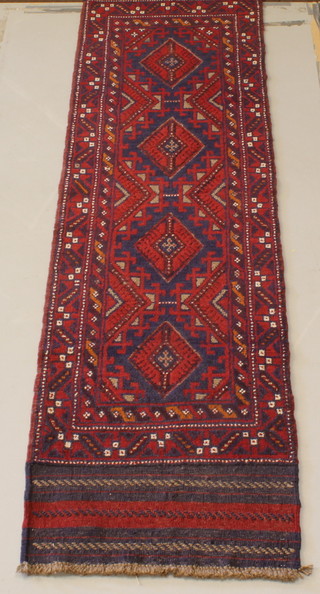 A Meshwani red and blue ground runner with 4 octagons to the centre 100" x 25" 
