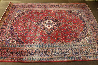 A red and blue ground Persian carpet with central medallion and floral ground 154" x 115" 