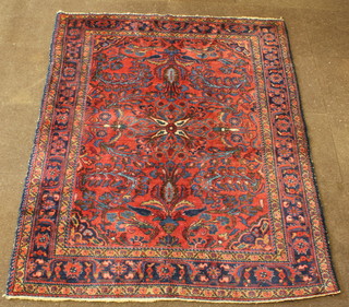 A Persian Lilian rug with blue ground and floral pattern 79" x 62" 