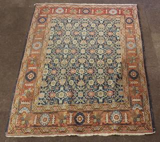 A Persian Isfahan rug with blue ground and floral pattern 71" x 55" 