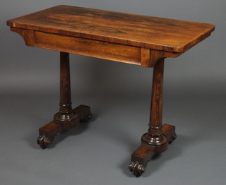 A William IV rectangular rosewood side table, fitted a frieze drawer and raised on turned columns, scroll feet 28 1/2"h x 40"w x 21"d