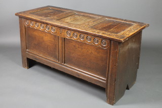 A 17th/18th Century coffer of panelled construction with long iron hinges and round carving to the front 25"h x 49"w x 20"d 2