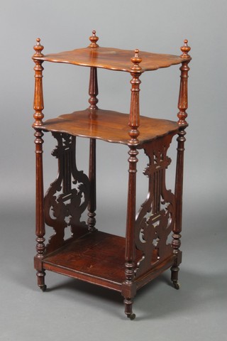 A Victorian rosewood 2 tier what-not with fret work lyre shaped panels to the side, raised on turned and fluted supports 32"h x 15"w x 13"d 