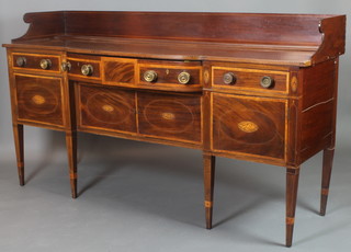 A George III Irish mahogany sideboard with three-quarter gallery and crossbanded top, fitted 1 long drawer flanked by 2 short drawers above a double cupboard, raised on square tapered supports, drawer with old label marked Nolan & Sons of Dublin 43"h x 78"w x 22"d 