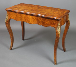 A 19th Century French inlaid walnut card table of serpentine outline with crossbanded top and gilt metal mounts, raised on cabriole supports 29"h x 35"w x 17"d 