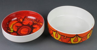 A Poole orange ground shallow bowl with geometric decoration 96 10", a red ground ditto 89 9" 