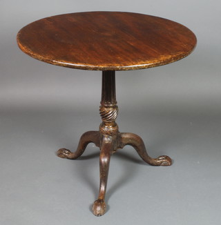 A Georgian mahogany circular snap top tea table, raised on a turned and fluted column with tripod base, egg and claw feet 28"h x 30" diam.