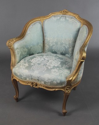 A 19th Century French gilt painted show frame salon armchair upholstered in blue material raised on cabriole supports 