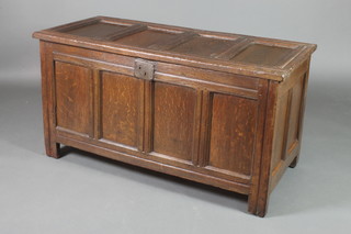 An 18th Century oak coffer of panelled construction with hinged lid, 25 1/2"h x 48"w x 22"d 