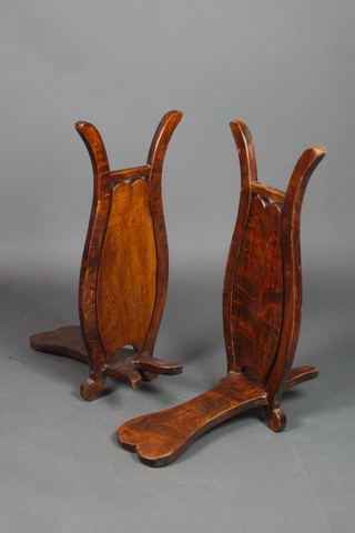 A pair of mahogany boot jacks
