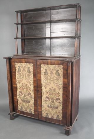 A Regency rosewood chiffonier, the raised back fitted 2 shelves and with columns to the sides above a cupboard enclosed by a panelled door, flanked by a pair of columns 69"h x 42"w x 19"d 