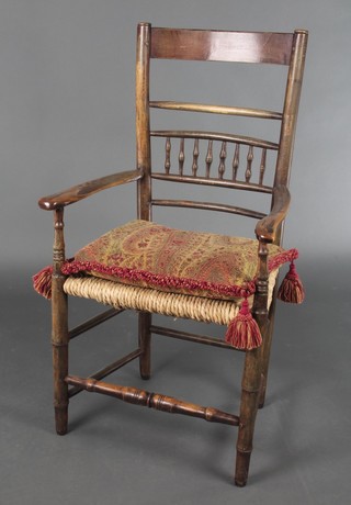 An elm bar back chair with bobbin turned decoration and woven rush seat 