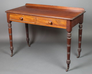 A Victorian rectangular mahogany side table with raised back, fitted 2 frieze drawers with tore handles, raised on turned supports 30"h x 42 1/2"w x 20"d 