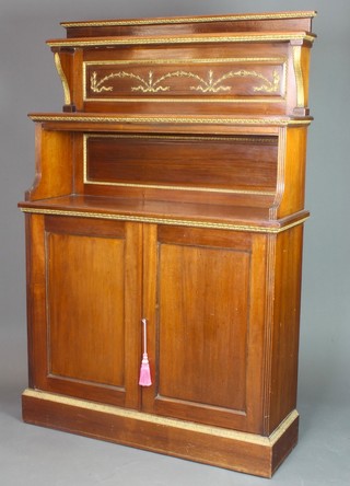 A 19th Century mahogany chiffonier, the raised back fitted 2 shelves above a recess and with cupboard beneath, having gilt painted embellishments, raised on a platform base 64"h x 42"w x 14"d 