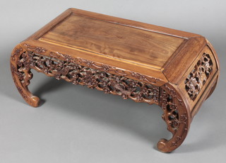 A rectangular carved Chinese Padouk occasional table with birds and prunus decoration raised on scrolled supports 16"h x 35"w x 18"d 