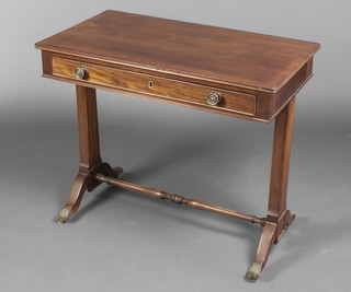 A 19th Century rectangular mahogany side table with crossbanded top, fitted 1 long drawer, raised on panelled supports, brass paw feet 28 1/2"h x 33 1/2"w x 18"d 